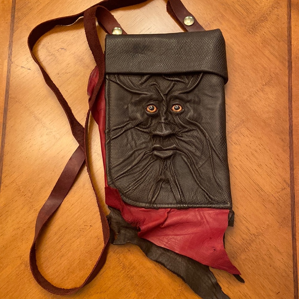 Leather bag with molded face
